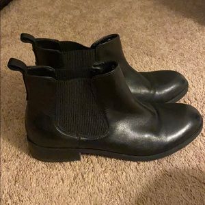 Black leather booties by Clarks